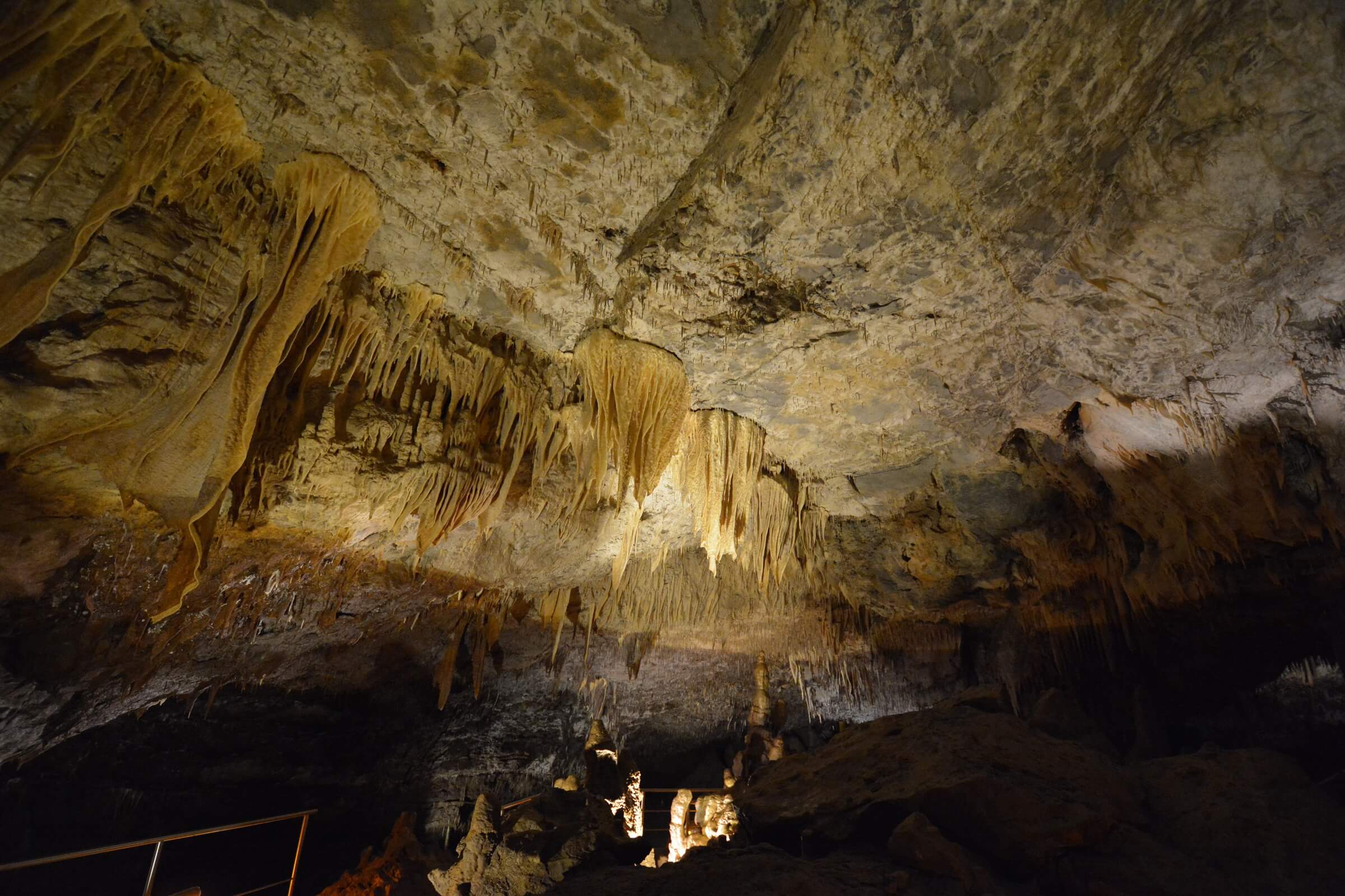 room with beige stalactites in kapsia cave